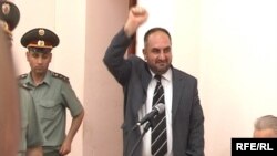 Armenia -- Jailed opposition MP Miasnik Malkhasian greets supporters during his trial on June 5, 2009.