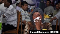 An Osh woman who lost her grandchild, son, and daughter during ethnic violence in June 2010 mourns at the commemoration ceremony on June 10.