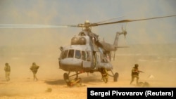 Russian marines disembark from a Mi-8 helicopter during the military exercises known as Center-2019 on the Caspian Sea coast on September 20.