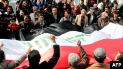 Iraqis demonstrate for reforms in Baghdad's Tahrir Square on February 24.