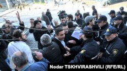 Georgian police break up a rally by veterans on Heroes' Square in Tbilisi on January 3.