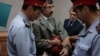 Сотрудники полиции берут под арест ведущего казахстанского правозащитника Евгения Жовтиса в зале суда. Баканас, 3 сентября 2009 года. Фото предоставлено газетой "Свобода слова". 