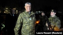 Kosovo's President Hashim Thaci walks past soldiers of the Kosovo Security Force during the army-formation ceremony in Pristina on December 14.