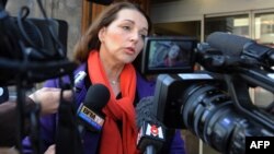 France -- Deputy Valerie Boyer, who authored the Armenian Genocide denial bill, answers journalists questions as she arrives at a police station in Marseille, 26Dec2011