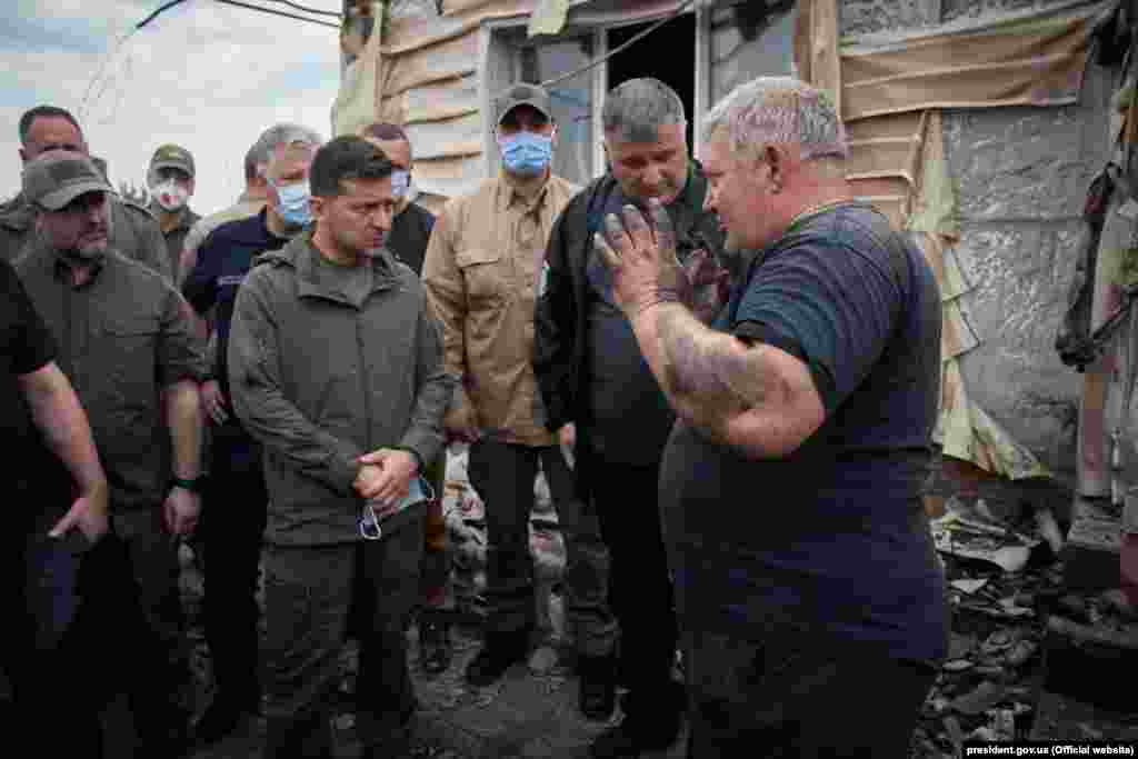 Ukrianian President Volodymyr Zelenskiy (center) visited the Luhansk region to survey the damage from large-scale forest fires on July 8.