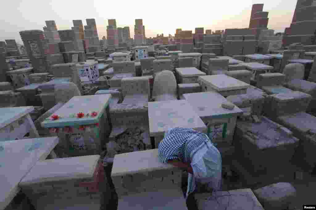 A man grieves at a cemetery in Najaf, south of Baghdad, Iraq. (Reuters/Alaa Al-Marjani)