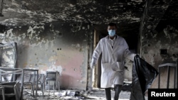 File photo of the aftermath of a militant attack in Balkh province in April.