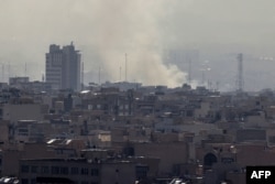 Дым над Тегераном после ударов Израиля и США