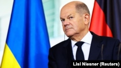 GERMANY – GermanGerman Chancellor Olaf Scholz looks on, as he and Ukrainian President Volodymyr Zelenskyy give statement before talks in Berlin, Germany, October 11, 2024