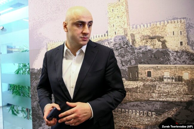 Nika Melia, head of the United National Movement, speaks to a journalist in Tbilisi on February 18.