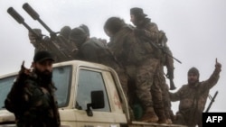 Security forces loyal to the new Syrian government set out on patrol (file photo).