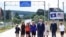 Kosovo -- US Vice President Joe Biden (C) joined by his wife Dr Jill Biden and other family members walk on a national road named after their late son Joseph "Beau" Biden, near the village of Sojevo, August 17, 2016
