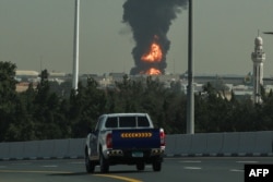A plume of plume rises from a fire at Dubai International Airport on March 16.