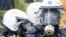 Belgian riot police are covered by hay and eggs thrown by demonstrators as farmers from all over Europe took part in a demonstration outside an EU farm ministers emergency meeting at EU Council headquarters in Brussels on September 7.