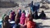 Schoolgirls study at an outdoor classroom in the rural district of Laghman Province in November 2012. (file photo)