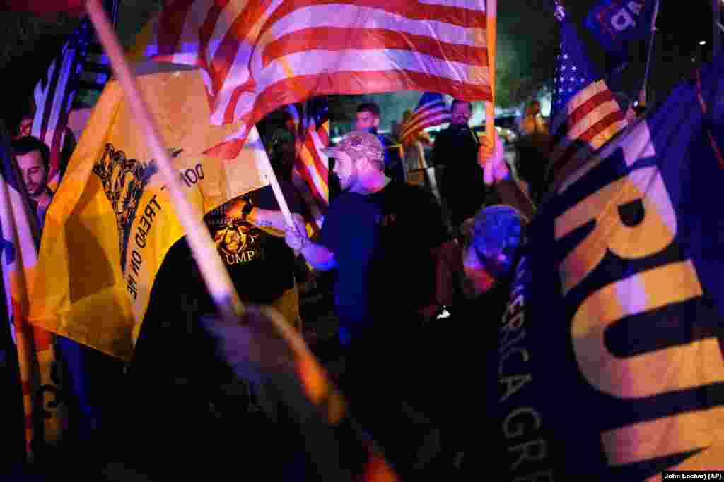 Supporters of President Donald Trump protest the Nevada vote in front of the Clark County Election Department, Thursday, Nov. 5, 2020, in Las Vegas. (AP Photo/John Locher)