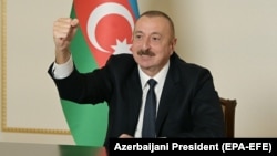 Azerbaijani President Ilham Aliyev gestures as he addresses the nation in Baku on November 9.