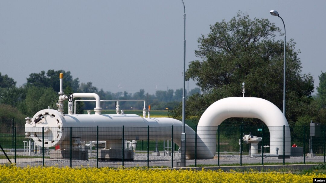 Gas pipes are pictured behind a field of rapeseed at Austria's largest natural-gas import and distribution station in Baumgarten.