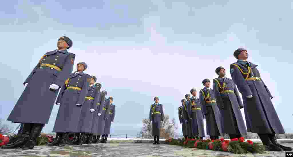 Kyrgyz National Guard soldiers stand at a memorial complex commemorating the victims of the April 2010 uprising in the village of Chon-Tash on November 16. (AFP Photo/ Vyacheslav Oseledko)