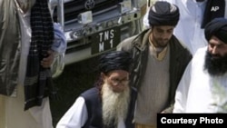 An antiterrorism court adjourned a hearing against militant leader Maulana Sufi Muhammad (front, center) after a key witness failed to appear in court in Peshawar on November 15.