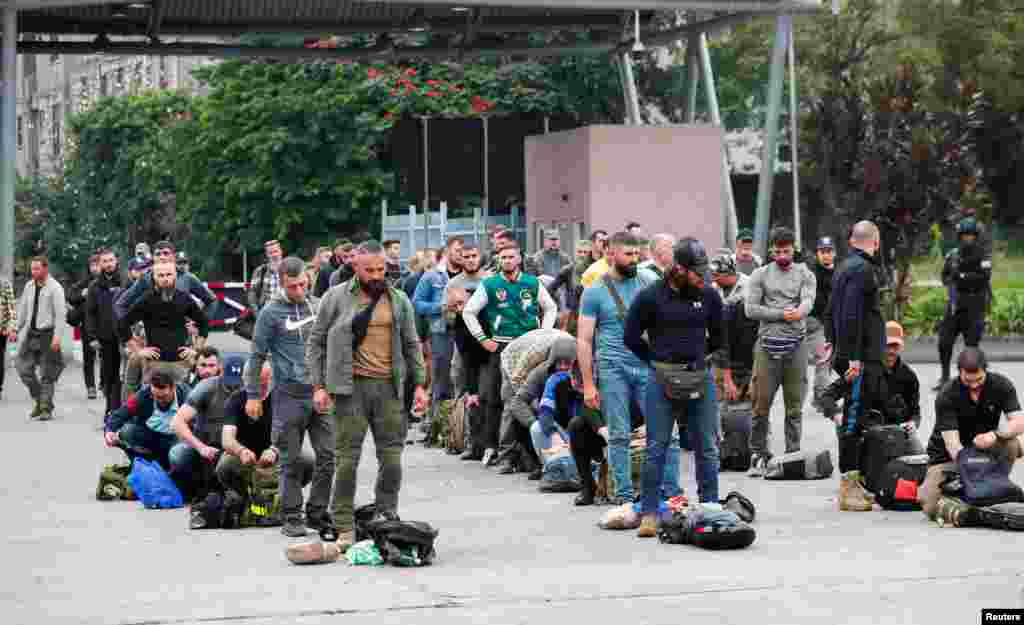 Romanian mercenaries wait in line to undergo screening as they are evacuated from Goma in the eastern Democratic Republic of Congo amid ongoing clashes between rebel groups and government forces.