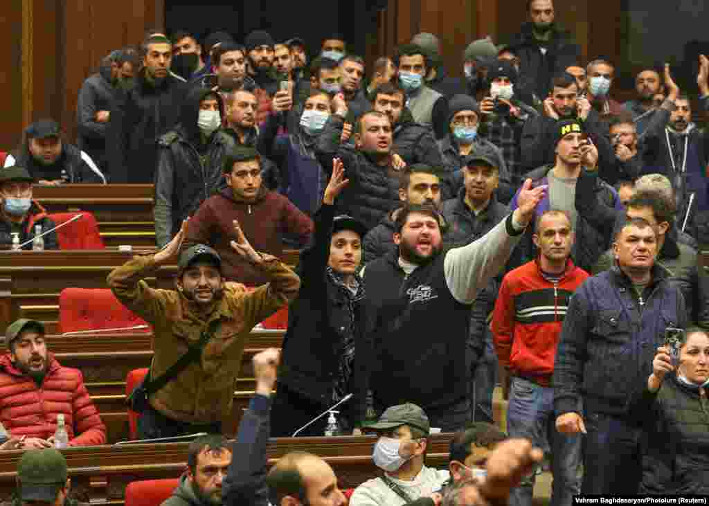 Demonstrators shout inside the parliament building. Parliament speaker Ararat Mirzoyan was&nbsp; hospitalized after being attacked during the protests.&nbsp;