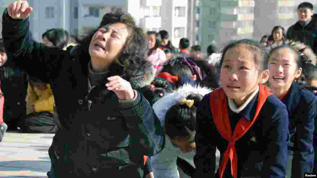 North Koreans react as they mourn the death of leader Kim Jong Il in Pyongyang on December 19. (Reuters)