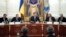Ukrainian President Viktor Yanukovych (center) at a meeting in Kyiv on November 5 to sign the Chevron deal.