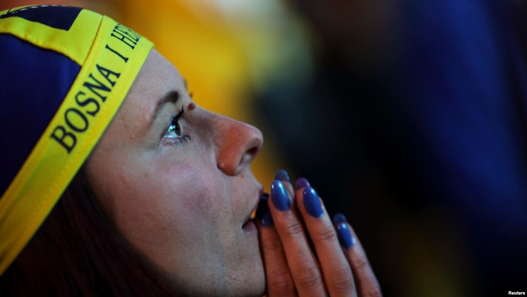 A Bosnian soccer fan reacts after Argentina scores a goal during the 2014 World Cup soccer match. 