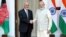 Afghan President Ashraf Ghani and Indian Prime Minister Narendra Modi shake hands on February 9 after signing an agreement to build the Shah Toot on the Kabul River.