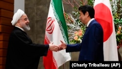 Iranian President Hassan Rohani meets with Japanese Prime Minister Shinzo Abe in Tokyo, December 20, 2019