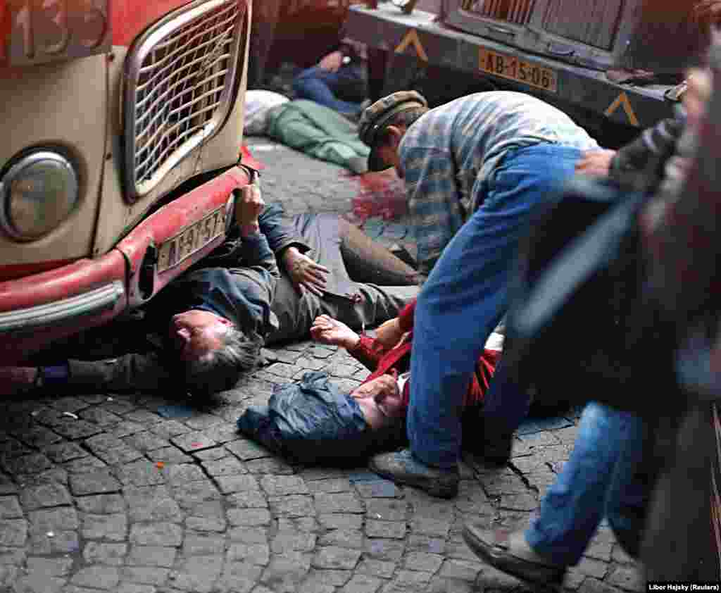 At least 15 people died outside Czechoslovak Radio headquarters that day, five of them when an unmanned truck plowed into the crowd for reasons that are still unclear. Hajsky was standing just a few meters away from the incident and took this picture. Years later, he found out that the man in the center dressed in red was called Vaclav Sadilek. When Hajsky attended a public showing of his photos more than two decades later, after the Velvet Revolution, a young man came up and introduced himself, saying he recognized his father in one of the pictures. &quot;He said that for 21 years they had no idea what had happened to him or how it happened,&quot; says Hajsky. &quot;He had recognized him there [in the picture]. It was quite an emotional moment.&quot;