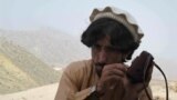 FILE: A picture made available on 20 June 2014 shows a local tribesman listening to news on a radio after Pakistani military launched an offensive in North Waziristan.