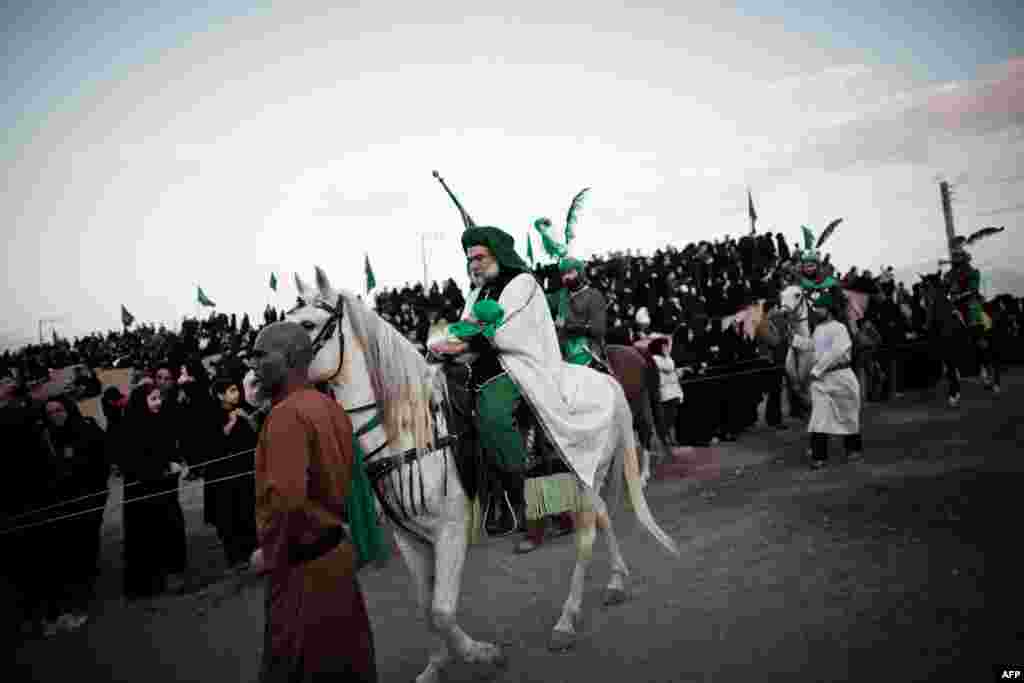 A performer, Ali Aghazedeh, takes the role of the Prophet Muhammad's grandson, Imam Hussein, as he enters the battle field.