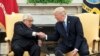 President Donald J. Trump shakes hands with former Secretary of State Henry Kissinger during their meeting in the Oval Office of the White House, in Washington, DC, 10 October 2017.