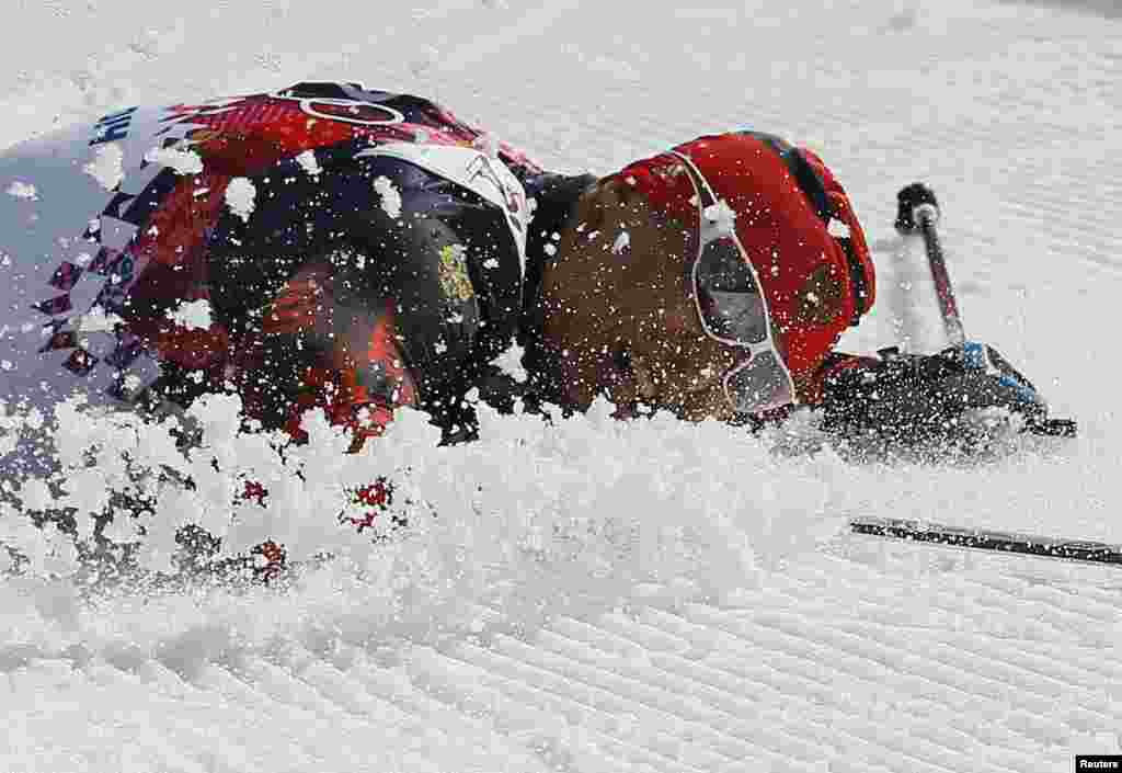 Russia&#39;s Alexander Legkov falls on the ground after winning gold in the men&#39;s cross-country 50-kilometer marathon. Russia took all three medals in this race. (Reuters/Stefan Wermuth)