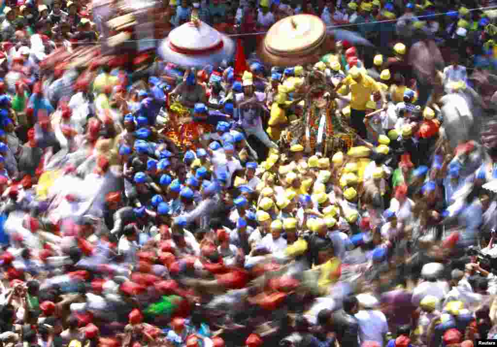 Devotees gather around chariots during the Chariot Festival at Ashon in Kathmandu, Nepal. (Reuters/Navesh Chitrakar)