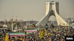 Iranians attend a rally in Tehran to mark the 34th anniversary of the Islamic revolution on February 10.