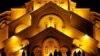 People stand before the Holy Trinity Cathedral during a midnight Christmas service in Tbilisi, Georgia, on January 7. (Reuters/David Mdzinarishvili)