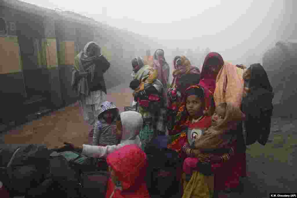 Waiting for a train at a station in Lahore, Pakistan. (AP/K.M. Chaudary)