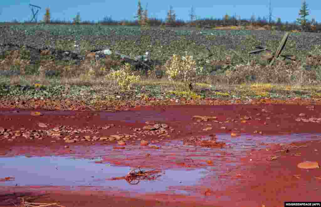 A photo from a previous chemical spill in the area in September 2016 shows puddles of bright red, polluted water on the banks of the River Daldykan near Norilsk. At the time, officials said the pollution may have been caused by a broken pipe at a Norilsk Nickel facility.&nbsp;