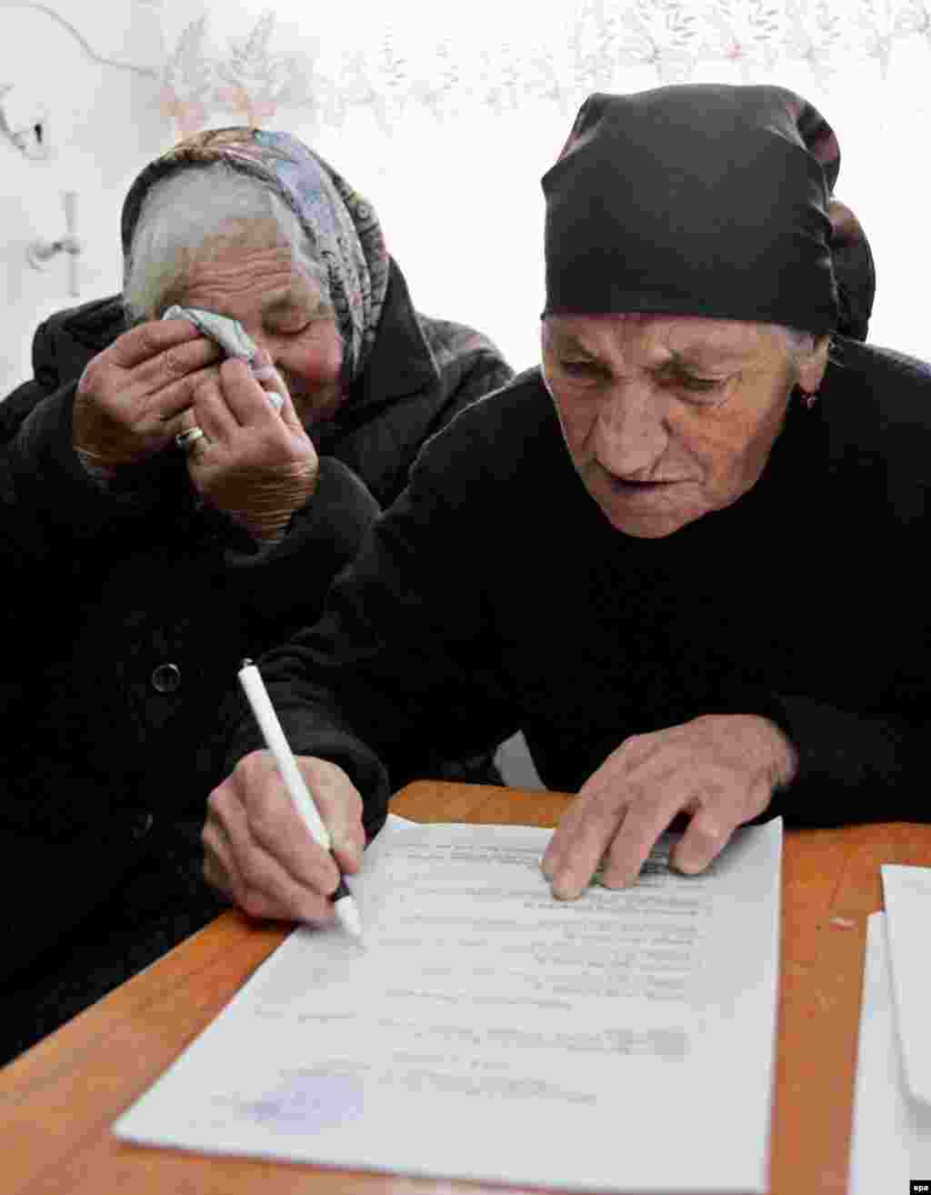 The breakaway administration of South Ossetia and the region's ethnic Georgians held rival referendums on independence in November (epa) - If the world could recognize Montenegro's vote for independence, would it accept referendums elsewhere? Transdniester and South Ossetia put that question to the test, and the answer was "no." But with Russia pushing for "universal principles" and with Kosovo on the verge of independence, the issue of the post-Soviet frozen conflicts is coming in from the cold.