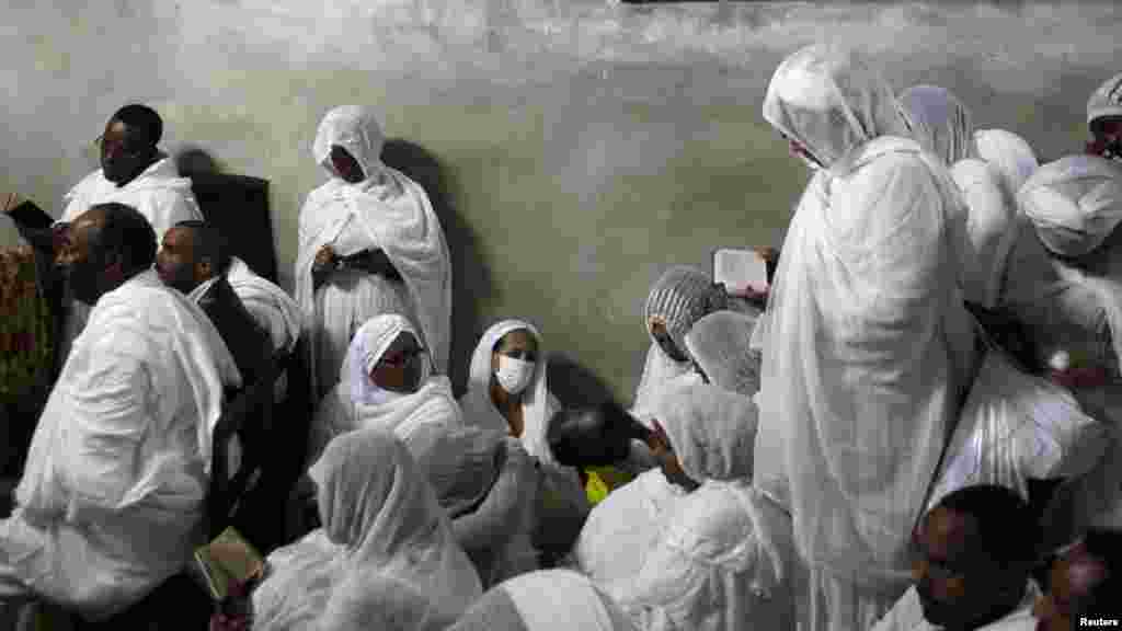 Ethiopian Orthodox worshipers attend the "Washing of the Feet" ceremony at the Ethiopian section of the Church of the Holy Sepulchre in Jerusalem's Old City on April 12. (Reuters/Ammar Awad)