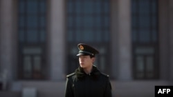 A policeman stands guard in Tiananmen Square (file photo)