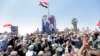 SYRIA QUNEITRA CONFLICT -- Hundreds of Syrians celebrate the flag-hoisting ceremony at al-Tahrir Square in the liberated city of Quneitra, southern Syria, 27 July 2018. 