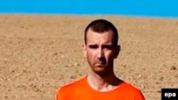 Похищенный в Сирии в марте 2013 года британский журналист Дэвид Хэйнс на кадре видео экстремистской группировки «Исламское государство». 