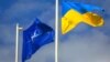 Ukraine – The national flag of Ukraine and NATO flag during the opening the teaching of the Ukraine-NATO disaster relief "Ukraine-2015". Lviv, 21Sep2015