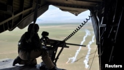 A German soldier in a CH-53 helicopter on its way from Mazar-e Sharif to Kunduz, March 27, 2017.