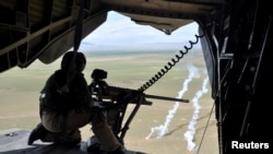 FILE: A soldier of the German armed forces Bundeswehr in a CH-53 helicopter on their way from Mazar-e Sharif to Kunduz in March 2017.