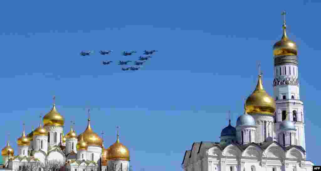 Russian fighter jets fly over the Kremlin cathedrals during a rehearsal of the Victory Day parade in Moscow. (AFP/Viktor Drachev)
